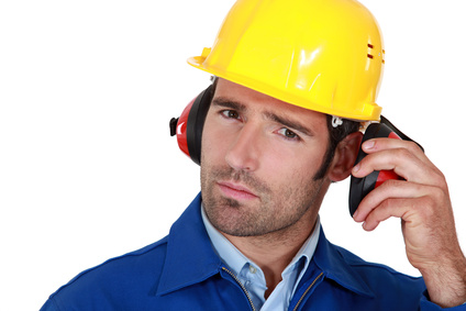 Man wearing safety earmuffs 