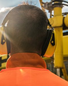 Working with Hearing protection ear muffs